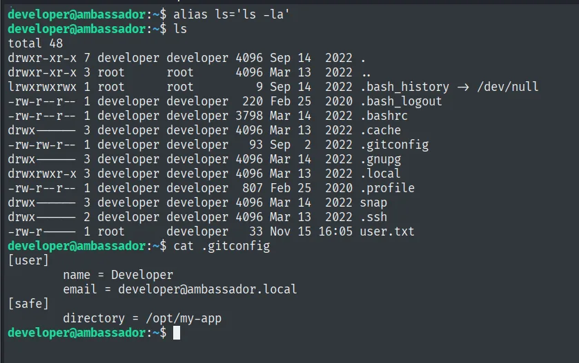 el listado del home de developer muestra .bash_history enlazado a /dev/null y un .gitconfig; su contenido declara /opt/my-app como safe.directory