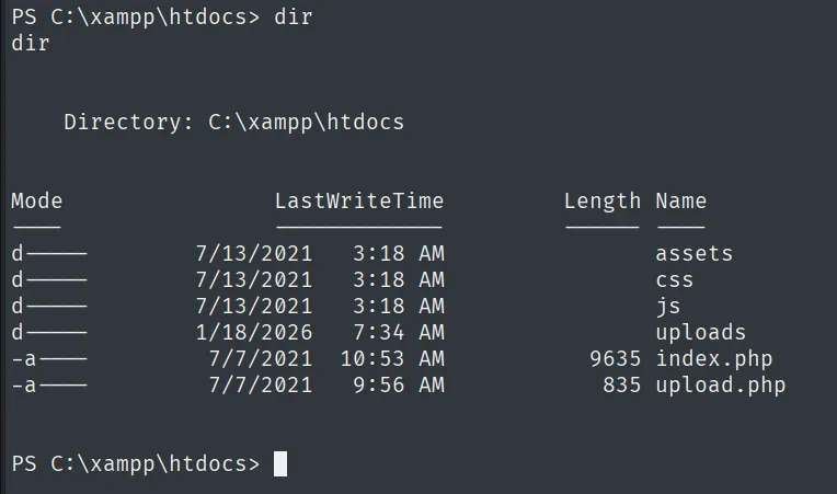 dir de C:\xampp\htdocs mostrando assets, css, js, uploads, index.php y upload.php